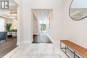 Burlington (Roseland) apartment for rent - A spacious hallway with a bench and a mirror on the wall.