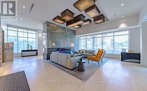 Toronto (Don Valley Village) condo for rent - A spacious living room with a large window and a modern design.
