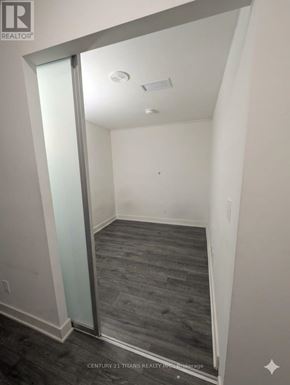 Toronto (Don Valley Village) condo for rent - A room with a glass door and grey flooring.