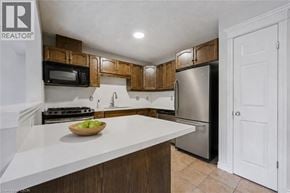 Guelph townhouse for rent - A kitchen with a bowl of fruit on the counter.