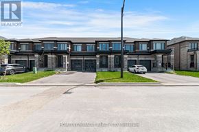 Kawartha Lakes (Lindsay) townhouse for rent - A building with the text "HOMELIFE/MIRACLE REALTY LTD. Brokerage" on the bottom.