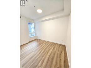 Coquitlam apartment for rent - A room with wooden flooring and a window.