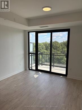 Milton (Cb Cobban) condo for rent - A room with a sliding glass door leading to a balcony.