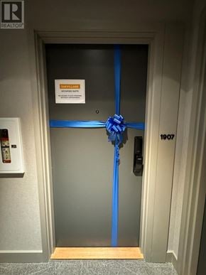 Oakville (Jm Joshua Meadows) condo for rent - A door with a blue ribbon and a sign that says "CANCELED".