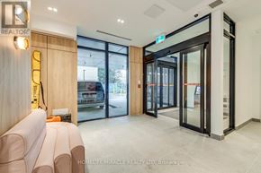 Toronto (Stonegate-Queensway) condo for rent - A realtor office with a couch and a door.