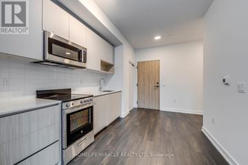 Toronto (Stonegate-Queensway) condo for rent - A modern kitchen with a stainless steel oven and microwave.