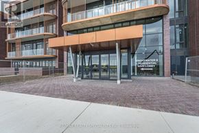 Mississauga (Port Credit) condo for rent - The entrance to a building with a glass door and a sign that reads "Brightwater II Residential".