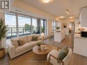 Vaughan (Concord) condo for rent - A well-lit, modern living room with a large window and a view of the city.