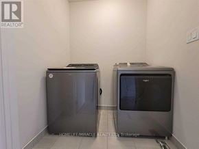 Zorra (Thamesford) townhouse for rent - A brokerage office with two refrigerators.