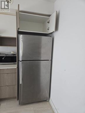 Burlington (Lasalle) townhouse for rent - A stainless steel refrigerator with its door open in a kitchen.