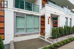 North Vancouver townhouse for rent - A modern building with a red door and windows.