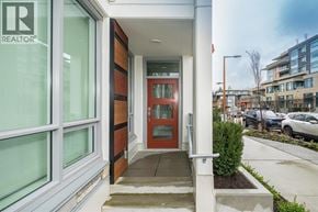 North Vancouver townhouse for rent - A realtor sign is on the window of a modern house.