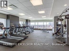 Mississauga (Central Erin Mills) condo for rent - A gym with treadmills, elliptical machines, and weight machines.