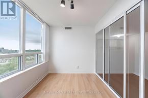 Toronto (Woburn) condo for rent - A room with a large window and sliding glass doors.