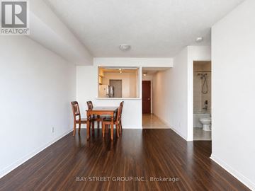 Toronto (Woburn) condo for rent - A dining room with a table and chairs in the middle of the room.