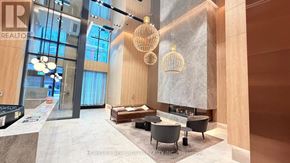 Toronto (Church-Yonge Corridor) condo for rent - A modern living room with a large window and a fireplace.