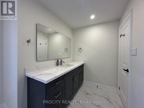 Mississauga (Erin Mills) apartment for rent - A bathroom with a sink and mirror.