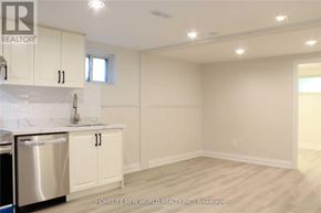 Toronto (Islington-City Centre West) apartment for rent - A kitchen with white cabinets and a stainless steel dishwasher.