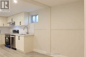 Toronto (Islington-City Centre West) apartment for rent - A kitchen with white cabinets and a dishwasher.