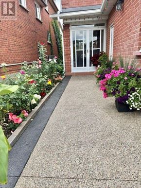 Mississauga (Hurontario) apartment for rent - A red brick building with a white door and windows.