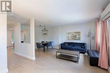 Mississauga (Meadowvale) townhouse for rent - A living room with a blue couch and a coffee table.
