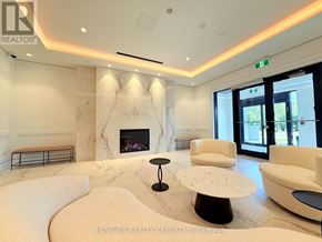 Toronto (Humber Heights) condo for rent - A living room with a fireplace and white furniture.