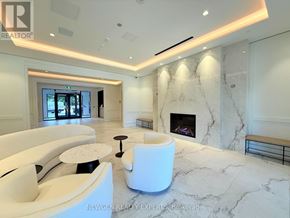 Toronto (Humber Heights) condo for rent - A white marble room with a fireplace and a bench.