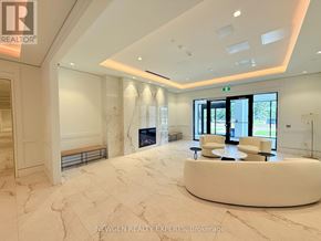 Toronto (Humber Heights) condo for rent - A spacious, well-lit room with a marble floor and a curved white bench.