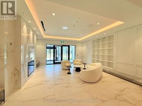 Toronto (Humber Heights) condo for rent - A spacious lobby with white furniture and a marble floor.