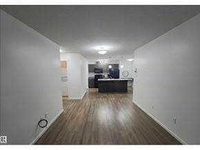 Edmonton apartment for rent - A long hallway with a reception desk at the end.