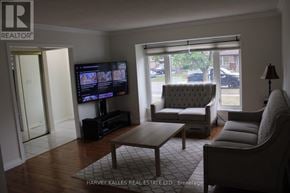 Brampton (Northgate) apartment for rent - A living room with a flat screen TV and a grey sofa.