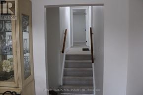Brampton (Northgate) apartment for rent - A hallway with stairs and a doorway leading to another room.