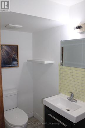 Brampton (Northgate) apartment for rent - A white toilet sits next to a white sink in a small bathroom.