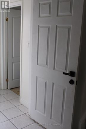 Brampton (Northgate) apartment for rent - A white door with a black handle and a gold doorknob.
