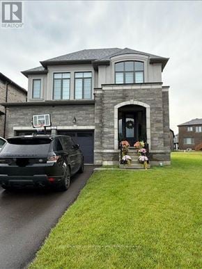 Woodstock (Woodstock - North) apartment for rent - A house with a car parked in front of it.