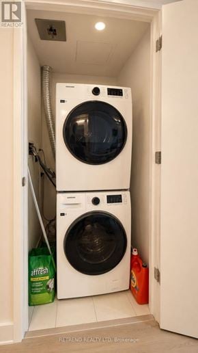 Toronto (Willowdale West) condo for rent - A white bathroom with a toilet, sink, and shower.