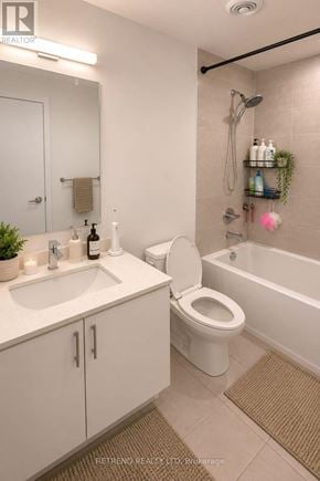 Toronto (Willowdale West) condo for rent - A white toilet and sink in a small bathroom.