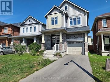 Niagara Falls (Brown) apartment for rent - A house with a grey car parked in front of it.