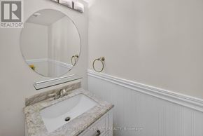 Ottawa townhouse for rent - A bathroom with a sink and a mirror.