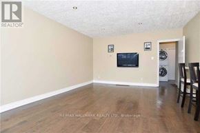 Ajax (South East) apartment for rent - A living room with a flat screen TV mounted on the wall.