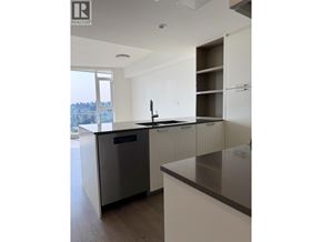 North Vancouver apartment for rent - A modern kitchen with white cabinets and a stainless steel dishwasher.