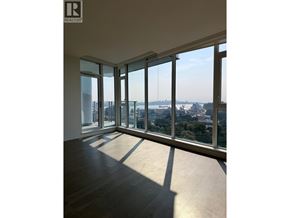 North Vancouver apartment for rent - A large empty room with a view of the city.