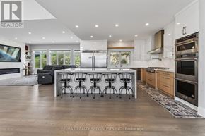 Cramahe apartment for rent - A modern kitchen with a dining table and chairs.