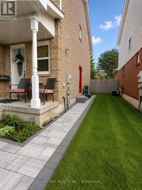 Georgina (Keswick North) apartment for rent - A brick house with a porch and a red door.