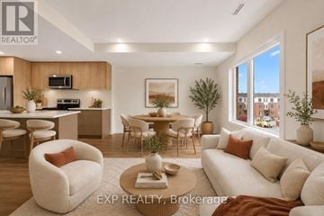 Ottawa townhouse for rent - A well-lit, modern living room with a dining area and kitchen in the background.