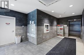 Waterloo condo for rent - A brokerage office with a white door and a calendar on the wall.