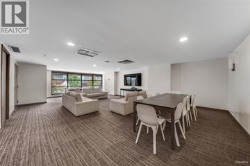 Vancouver apartment for rent - A living room with a brown carpet and white furniture.