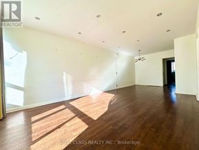 Richmond Hill (Crosby) apartment for rent - A large empty room with wooden floors and a ceiling fan.
