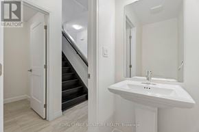 Hamilton (Stoney Creek Mountain) townhouse for rent - A white bathroom sink with a mirror above it.
