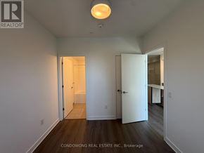Toronto (Regent Park) condo for rent - A room with a white door and a white ceiling light.